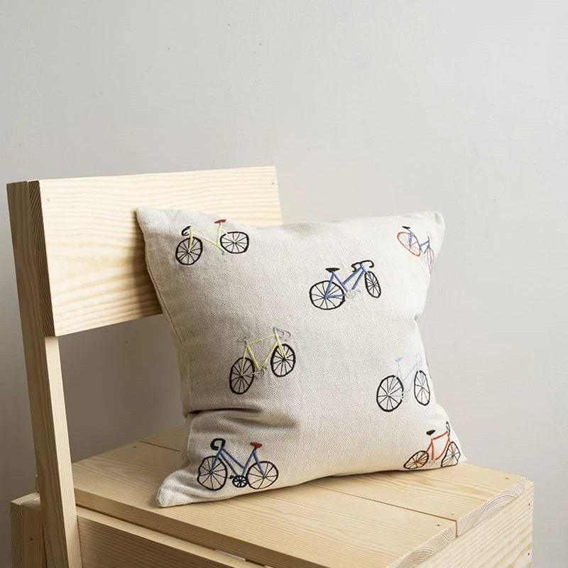Bicycles Embroidered Cushion Cover fra Fine Little Day på stol