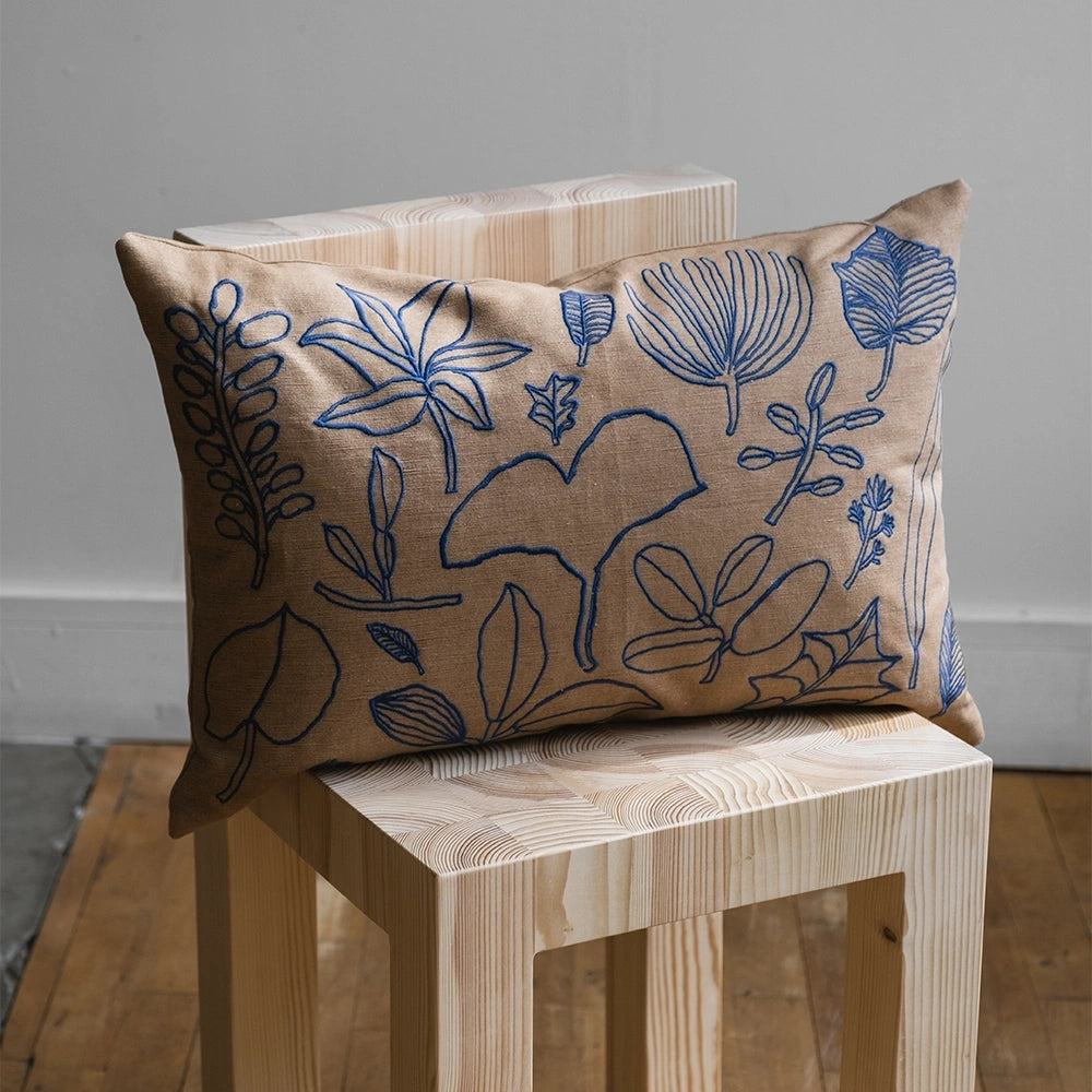 Botanic Leaves Embroidered Cushion Cover fra Fine Little Day på stol